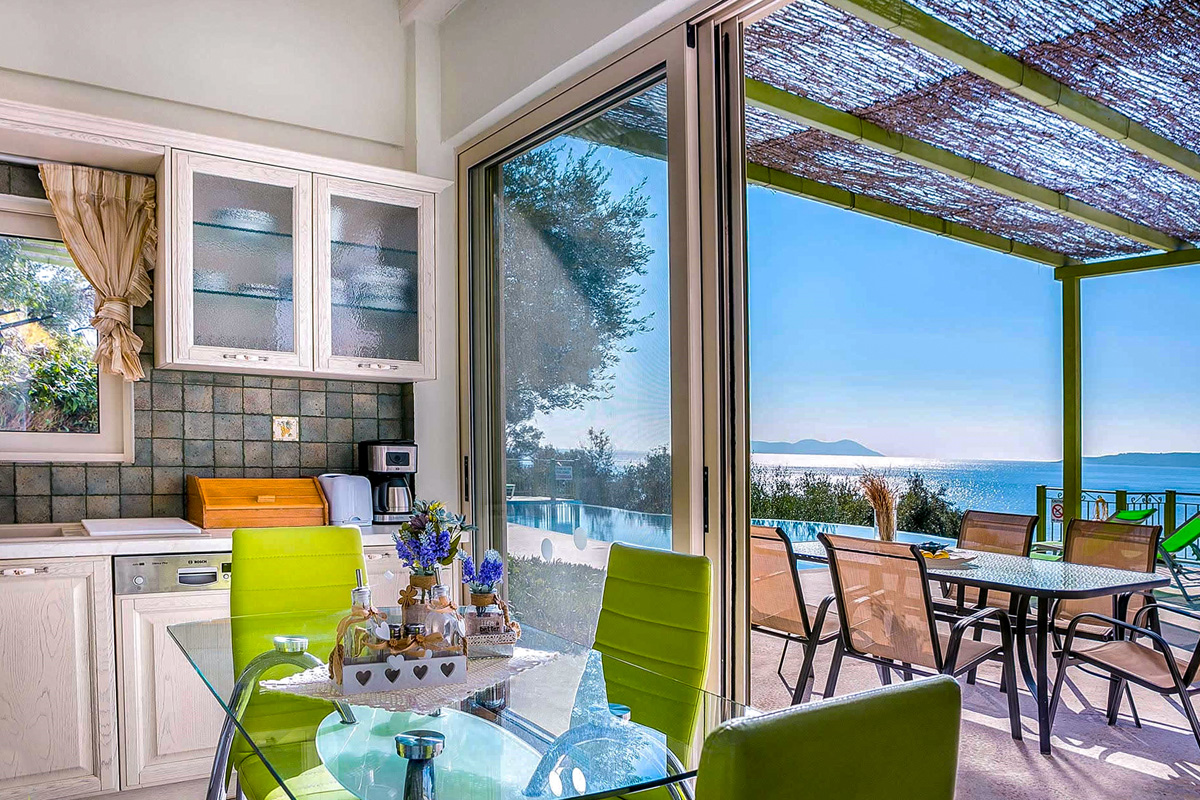 villa votsalo sivota lefkada greece fully equipped kitchen dining table direct access to outdoor area with views outdoor furniture