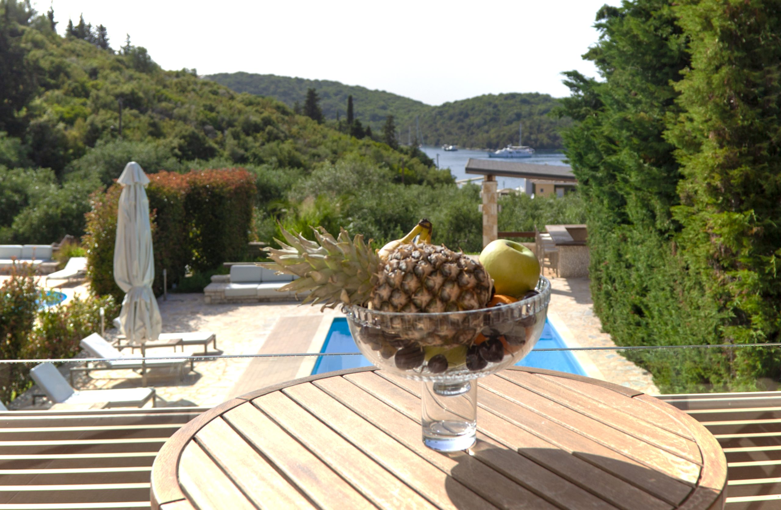 villa guilia sivota lefkada epirus greece balcony table mountain view garden umbrella fruits scaled