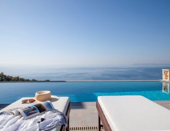 05 villa aldena lefkada greece pool lounge chairs sea