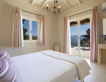 ionian luxury villas levanda lefkada perigiali bedroom pillows mirror flowes windows view