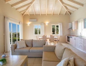 ionian luxury villas levanda lefkada perigiali living room sofa kichen windows table chairs relaxing