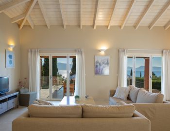 ionian luxury villas levanda lefkada perigiali living room tv pillows sofa windows view