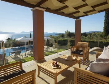 ionian luxury villas levanda lefkada perigiali outdoor lounge pillows swimming pool view beach chairs umbrellas trees mountain
