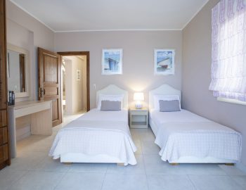 ionian luxury villas olivia lefkada perigiali bedroom single beds closet door furniture window curtain pillows