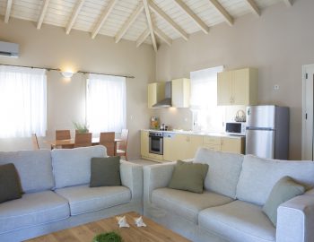 ionian luxury villas olivia lefkada perigiali kitchen living area fridge door pillows chairs table