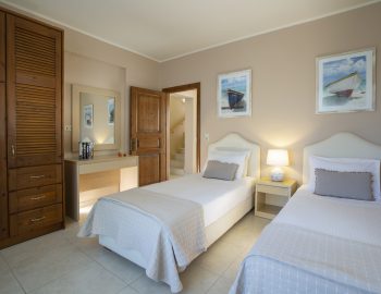 ionian luxury villas olivia lefkada perigiali single beds door closet pillows mirror