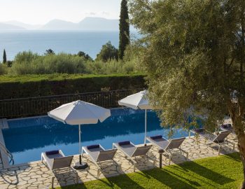 ionian luxury villas olivia lefkada perigiali swimming pool view garden trees beach umbrella