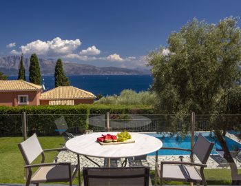 ionian luxury villas olivia lefkada perigiali table swimming pool trees food table chairs