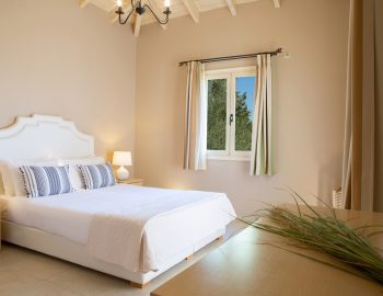 ionian luxury villas olivia lefkada perigiali window flowers bed double pillows curtains