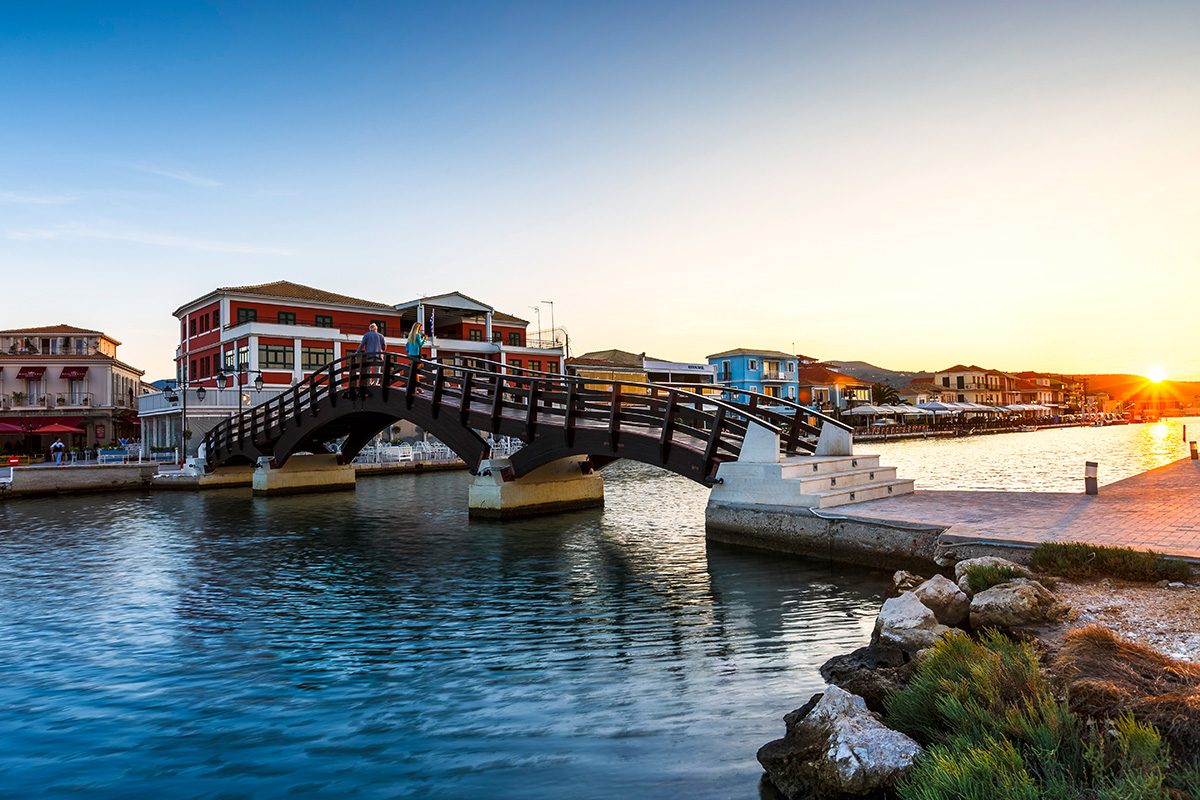 lefkada town walking bridge with sunset greece