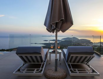 villa agatha sunset sivota epirus greece sunbeds umbrella with sunset view
