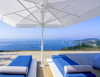 villa blue ionian sivota greece accommodation sun beds with umbrellas and ionian archipelagos view