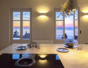 villa da lula agios nikitas greece indoor dining with sunset