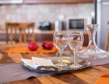 villa dendrilia kassiopi corfu greece winde glasses on dining table