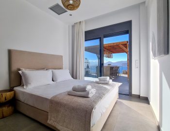villa empeiria paleros greece bedroom window towles pillows relaxing