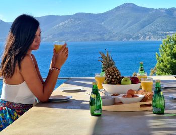 villa empeiria paleros greece girl enjoy fruits sea view mountain food table chairs