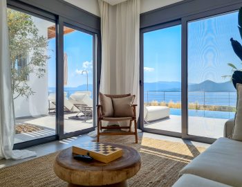 villa empeiria paleros greece living room table sofa armchair view pool view