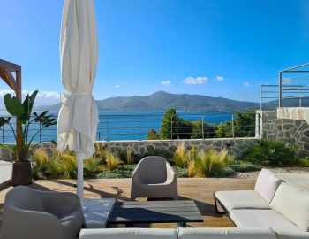 villa empeiria paleros greece stairs outdoor sitting area sea view mountai view umbrella table trees