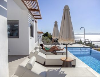 villa empeiria paleros greece swimming pool beach chair umbrella sun girl swimming outdoor
