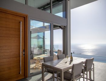villa glass syvota epirus greece outdoor dining area