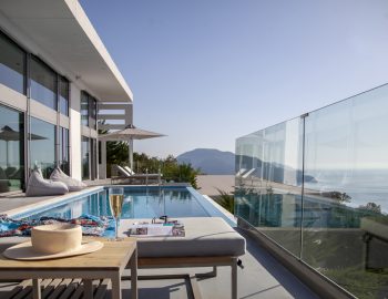 villa glass syvota epirus greece relaxing around the pool