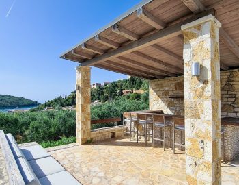 villa guilia sivota lefkada epirus greece outside sofa stone hight chairs relaxing mountain view small bar sky ocean view