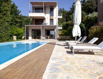 villa guilia sivota lefkada epirus greece swimming pool property building outdoor seating area garden flowers sun day beach chairs