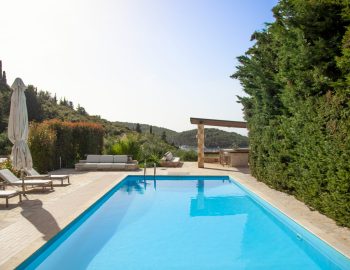 villa guilia sivota lefkada epirus greece swimming pool trees mountain sofa beach chairs