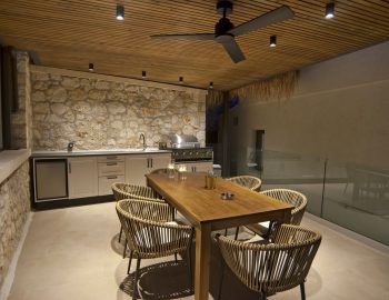 villa haris nidri lefkada barbeque dining area autside wooden furniture