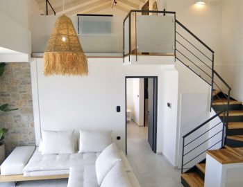 villa haris nidri lefkada living room wooden stairs white house mat light