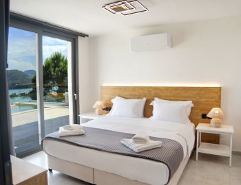 villa haris nidri lefkada white bedroom wood grey view balcony