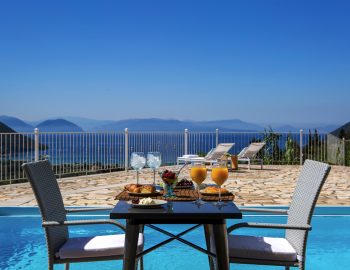 villa katsiki vasiliki cottages lefkada greece panoramic sea ocean sunset mountain city view privacy private space pool deck chair patio for couple breakfast sitting dining area outside