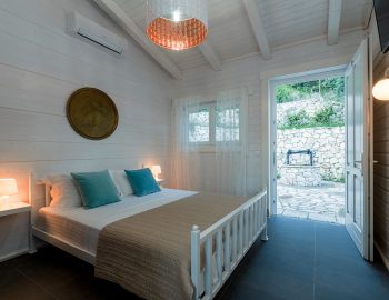 villa-mylos-vasiliki-cottages-lefkada-greece-adults-only-accommodation-double-bedroom-with-garden-view