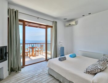 villa-paleros-greece-master-bedroom-with-private-balcony
