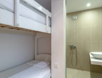 villa-paleros-greece-twin-bedroom-with-bathroom