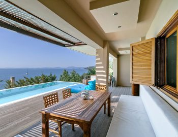 villa-scorpios-pogonia-paleros-greece-pool-side-seating-and-dining