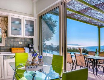 villa votsalo sivota lefkada greece fully equipped kitchen dining table direct access to outdoor area with views outdoor furniture