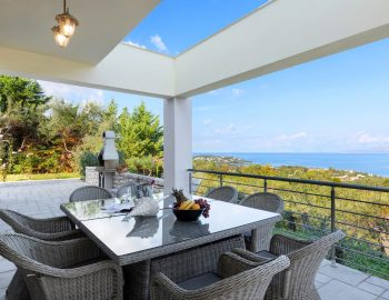 villa white stone kassiopi corfu greece outside dining area with view