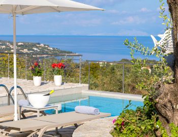 villa white stone kassiopi corfu greece sunbeds and pool