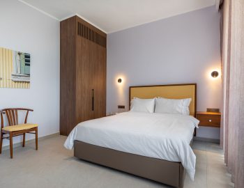 z4 luxury villa bita lefkada bedroom blanket pillows closet chair bedside table
