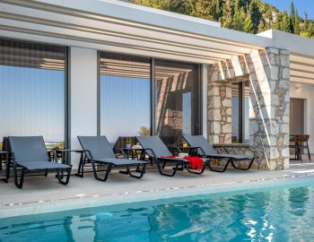 z4 luxury villa delta lefkada grecce swimming pool beach chairs sun mountain trees
