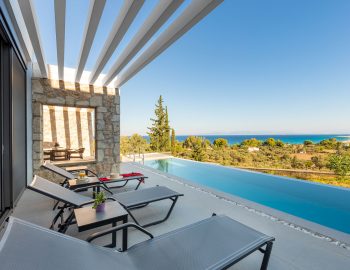 z4 luxury villa delta lefkada greece swimming pool beach chairs sea view trees